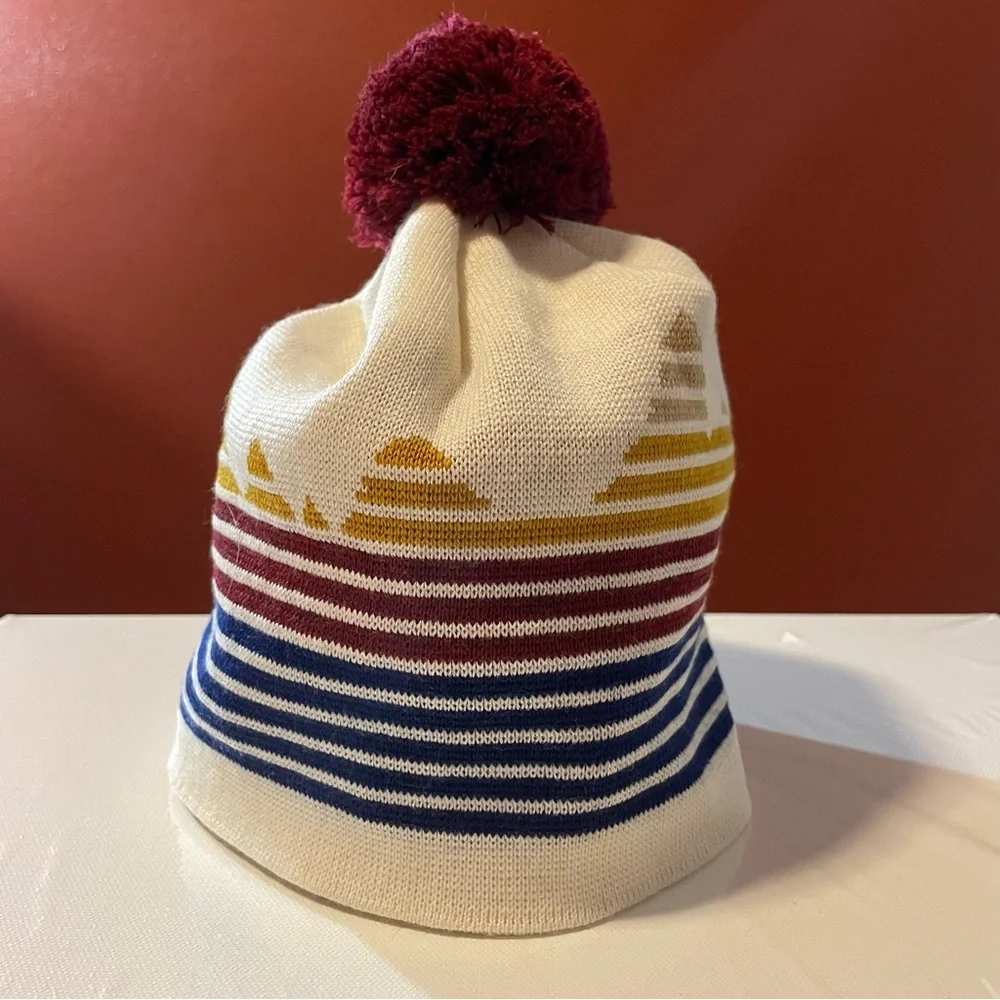 Stio Cream Knit Pom Beanie with Maroon Pom and Multicolor Stripes